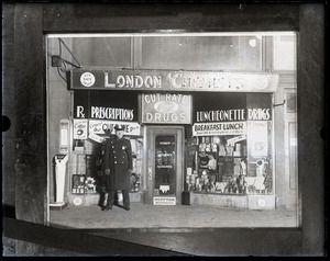 Policeman in front of the drugstore where Vincent Coll was killed