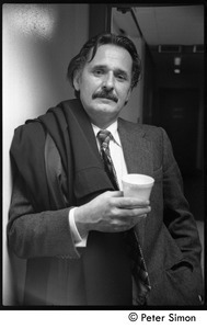 Unidentified man backstage at Saturday Night Live, holding a cup