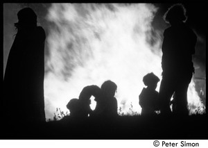 After the Maypole celebration, Packer Corners commune: silhouette and bonfire