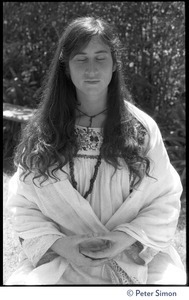 Dolma: half-length portrait, seated in lotus position, meditating, with bhairava mudra