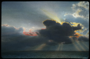 Lake Champlain (sun behind cloud with red and yellow lining over lake)