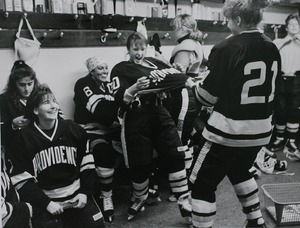 Providence College women's ice hockey team joking around in the locker room