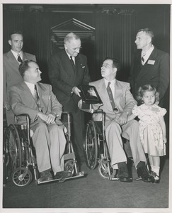 President Harry S. Truman handing a plaque to Nils S. Josefson