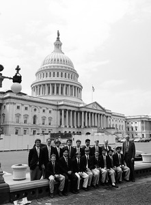 Congressman John W. Olver with group of visitors, posed in front of the United States Capitol building