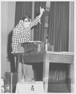 Henry B. Peirce Jr. directing on stage