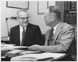 John W. Lederle and Lamar Soutter chatting in an office