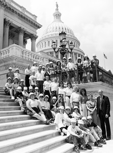 Congressman John W. Olver (right) with unidentified group on the steps of the United States Capitol building