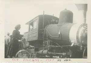 Bernice Kahn and son Joel, in wheelchair, admiring the Cog Railway train