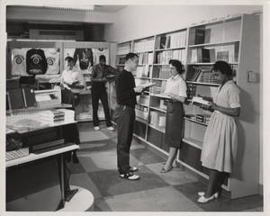 Students reading in bookstore (1959)
