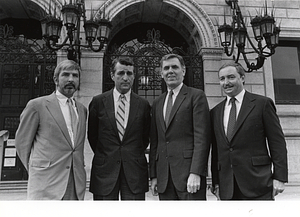 Boston Public Library Trustees Kevin F. Moloney and William O. Taylor, Mayor Raymond L. Flynn, Boston Public Library Director Arthur Curley in front of Boston Public Library