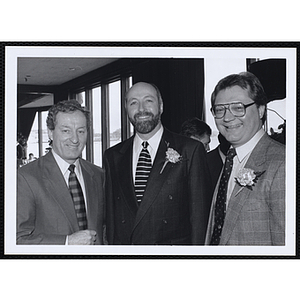 Ed Hoell, at center, and two unidentified men posing together at a St. Patrick's Day Luncheon