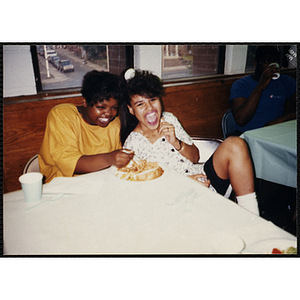 Two girls laugh together at the Best-Year-In-School-Ever Recognition Dinner in Roxbury, Boston