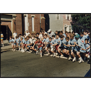 Children take off from the start line at the Battle of Bunker Hill Road Race