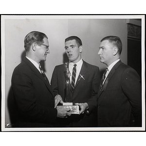 "Flynn receives Governor's Trophy at Father and Son Supper City Wide Boys' Workers Conference"