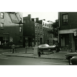 Man stands near a corner in Boston's Chinatown