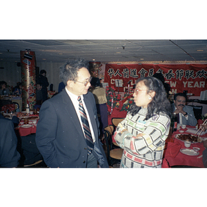 Man and woman attend the Chinese Progressive Association's celebration of the Lunar New Year