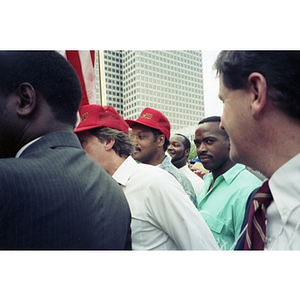 Jan Pierce, Vice President of the Communication Workers of America, (second from left), and Rainbow Coalition leader Jesse Jackson (third from left) at the NYNEX workers' strike and rally at City Hall Plaza, Boston