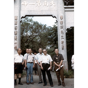 Chinese Progressive Association members at an arch in China