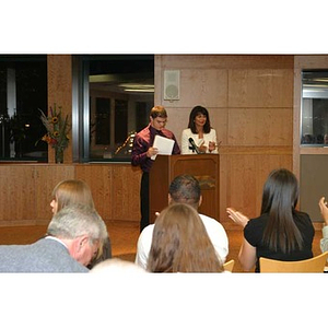 Joseph Bordieri and Philomena Mantella stand at the podium at the Torch Scholars dinner