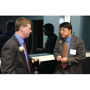 Dr. Homer H. Pine converses with a guest at The National Council Dinner