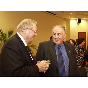 Neal Finnegan (CBA '61), left, and Harry P. Keegan III, CBA '64) conversing at the College of Business Administration's Distinguished Service Awards ceremony