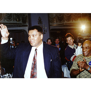 Muhammad Ali waves to crowd at Hall of Fame ceremony