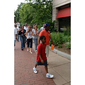 Ulysses Ifill in front of the group on a campus tour