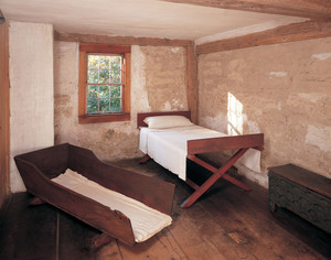 Chamber showing bed and cradle, Coffin House, Newbury, Mass.