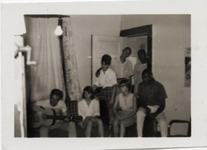 Civil rights workers inside Freedom House, including Gloria Xifaras Clark (standing left), Kathy Dahl (seated, 2d from the right), and U.Z. Nunnally (seated far right)
