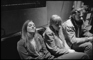 Judy Collins, Joni Mitchell, and unidentified man seated on a couch in Wally Heider Studio 3 during production of the first Crosby, Stills, and Nash album