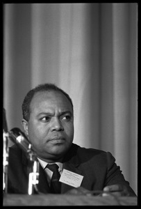 James Farmer, seated as part of a panel at the Youth, Non-Violence, and Social Change conference, Howard University