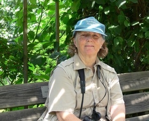 Kathy McGinley (Audubon Society volunteer) seated on a bench, Wellfleet Bay Wildlife Sanctuary