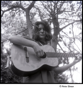 Lucy Simon playing guitar