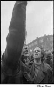 MIT war research demonstration: demonstrator shouting with raised fist