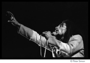 Bob Marley in concert, gesturing to the audience