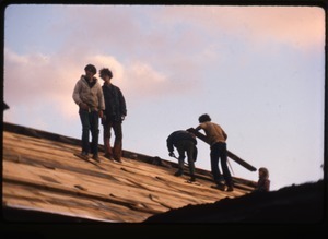 Tony Mathews and crew roofing the barn, Montague Farm commune