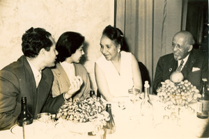 W. E. B. Du Bois, Shirley Graham Du Bois, and two unidentified people at dinner