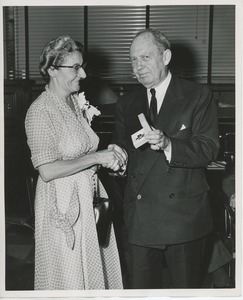 Jeremiah Milbank, Sr. shaking hands with Mrs. Nesta James Brick