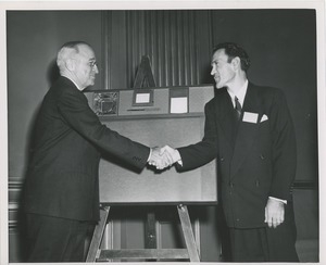 President Harry S. Truman shaking hands with Mr. Yofan