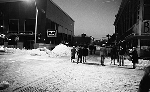 Pedestrians walking on snowy street