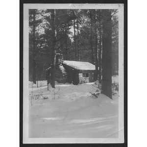 View of building and trees in snow at unidentified YMCA camp