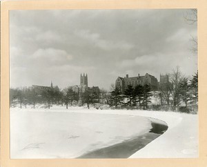 Devlin Hall, Gasson Hall, Saint Mary's Hall, and Bapst Library from reservoir in winter, by Clifton Church