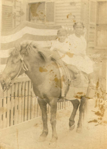 Aunt Phyllis & cousin Cathleen on horse