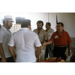 Four men having a discussion.