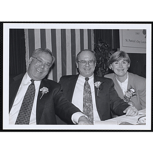 Thomas M. Menino, Mayor of Boston, seated with an unidentified man and woman, at a St. Patrick's Day Luncheon