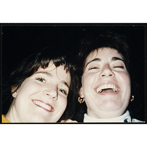 Close-up of two young women laughing