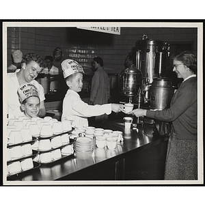 Two members of the Tom Pappas Chefs' Club assist with coffee service in the Hanscom Field Air Force Base restaurant