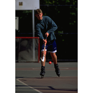 Student playing roller hockey