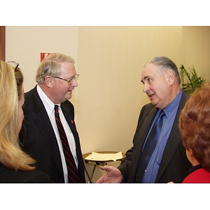 Neal Finnegan (CBA '61), left, and Harry P. Keegan III (CBA '64) conversing at the College of Business Administration's Distinguished Service Awards ceremony