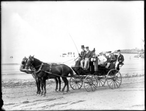 Carriage drawn by two horses on the beach
